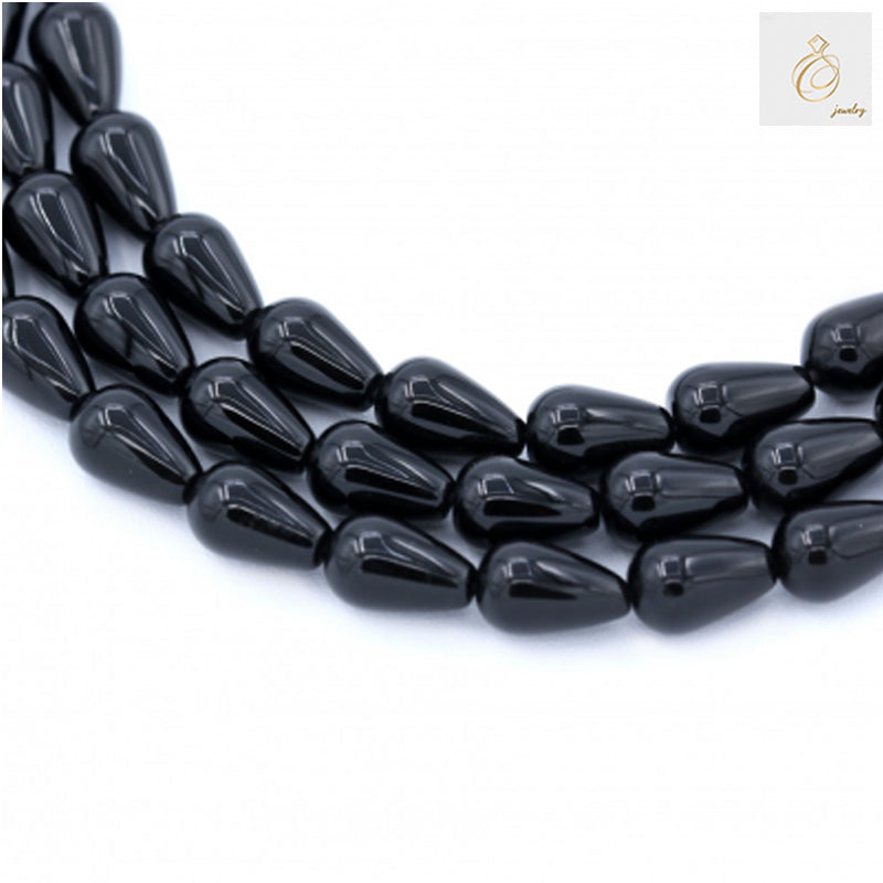Black Agate Teardrop Beads 8x12mm - Multiple strands showing glossy black teardrop-shaped gemstone beads for jewelry making