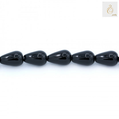 Black Agate Teardrop Beads 8x12mm - Close-up view of individual teardrop-shaped black agate stones on strand