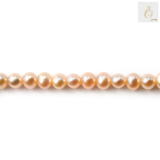 Champagne freshwater cultured pearl strand, oval 5.5-6mm pearls, 39-40cm length, showcasing warm luster and elegant texture