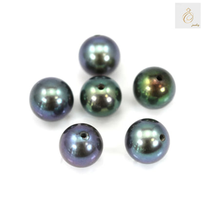 Close-up view of dark blue freshwater cultured pearls showing lustrous surface and round shape, 4.5-5mm size