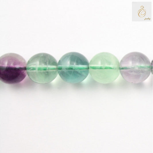 Natural fluorite round beads 8mm on white background showing translucent purple and green colors"
"Close-up view of 8mm fluorite gemstone beads displaying natural color variations"
"Full strand of natural fluorite round beads 39cm length for jewelry making