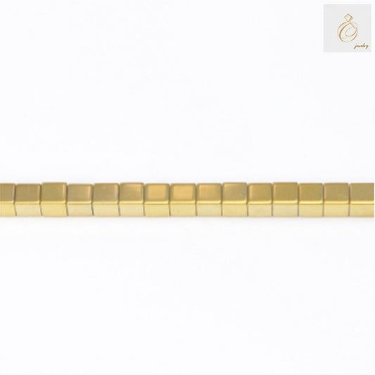 Golden hematite cube beads 3mm with 0.8mm holes arranged on 39-40cm strand, showing lustrous golden metallic finish and precise geometric cube shape