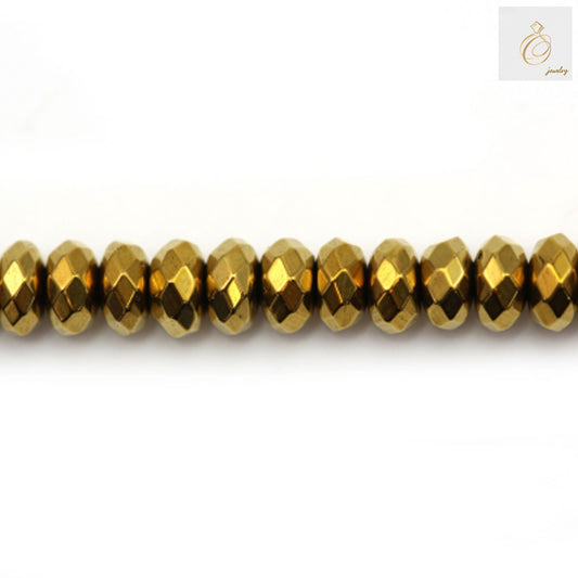 Golden hematite faceted abacus beads 2x4mm arranged on strand showing metallic luster and uniform shape
