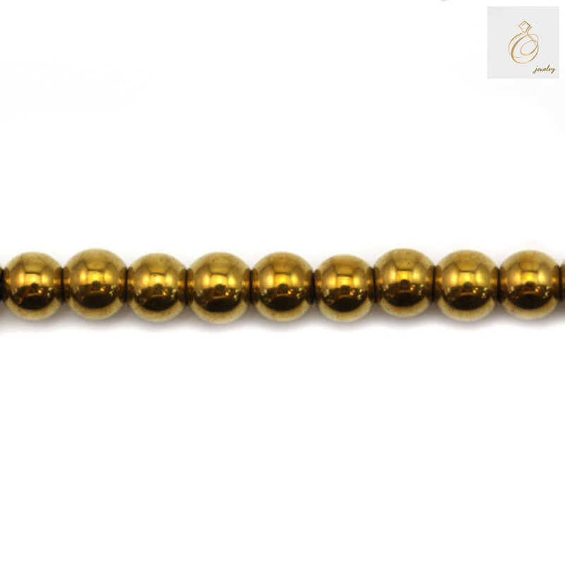 Golden hematite round beads 3mm diameter with metallic finish on white background