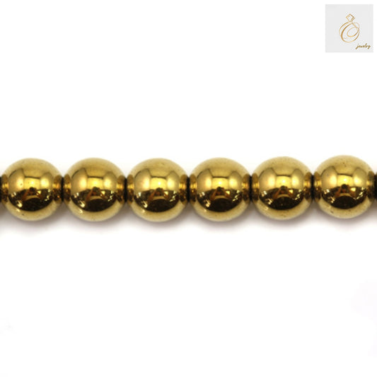 Golden hematite round beads 8mm diameter with metallic luster on white background