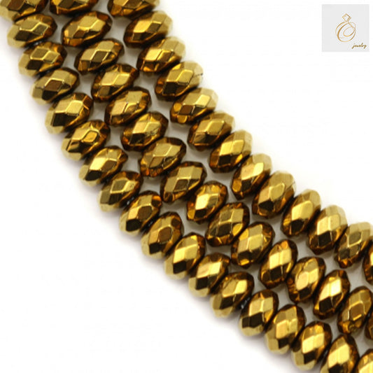 Close-up view of golden hematite faceted abacus beads 2x4mm displaying brilliant golden color and precise faceted cuts