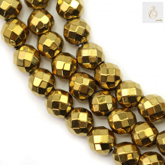 Close-up view of golden hematite beads strand displaying faceted surface and consistent 6mm sizing