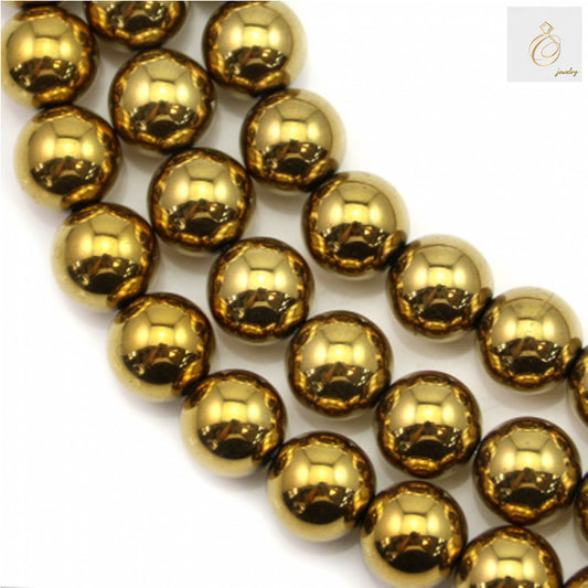 Close-up view of golden hematite round beads strand, showing uniform 10mm size and lustrous golden surface
