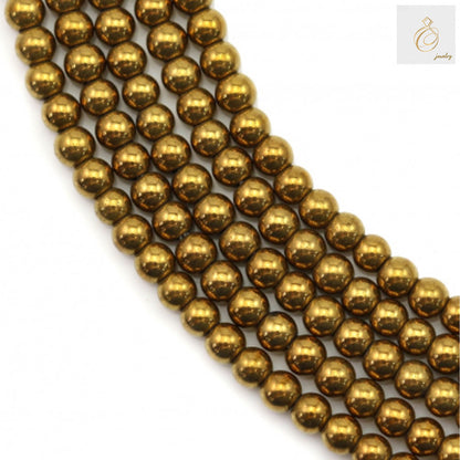 Close-up view of golden hematite round beads showing lustrous metallic surface and uniform 2mm size