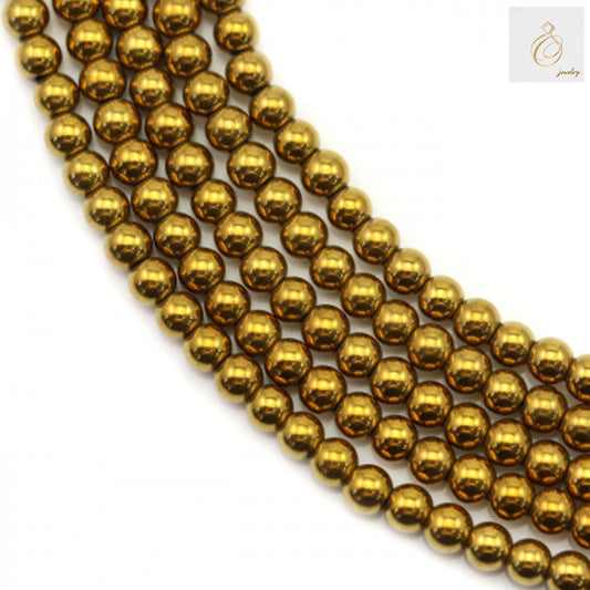Close-up view of golden hematite round beads strand showing uniform size and lustrous finish