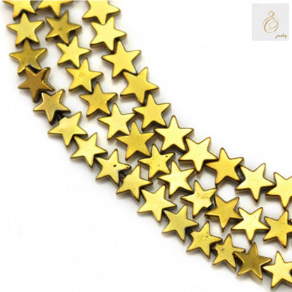 Close-up view of golden hematite star beads showing detailed star shape and lustrous golden coating