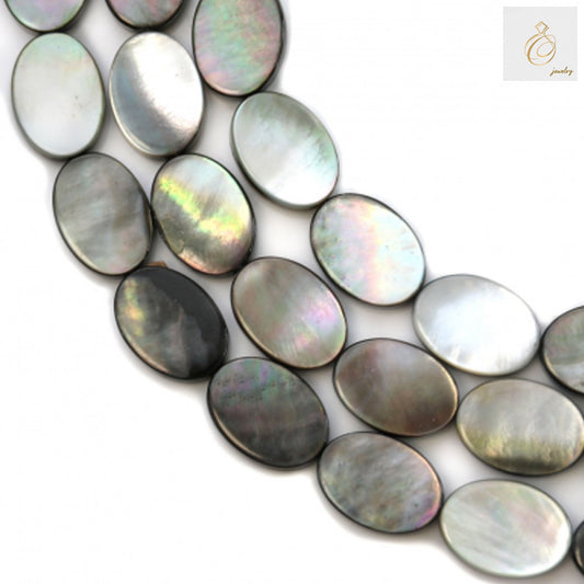 Close-up view of gray mother-of-pearl shell oval beads displaying smooth surface texture and consistent 10x14mm sizing