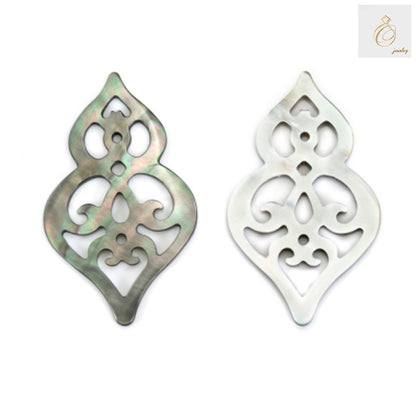 Close-up view of gray mother of pearl shell charm showing natural texture and hollow calabash design