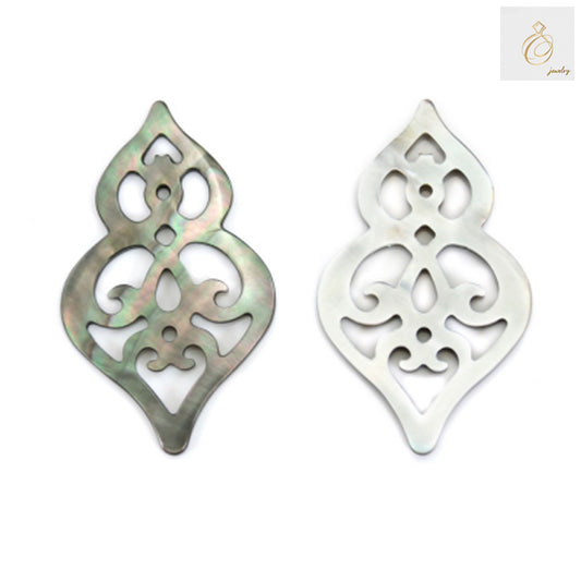 Close-up view of gray mother of pearl shell charm showing natural texture and hollow calabash design
