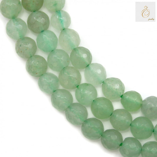 Green aventurine faceted round beads 6mm on strand showing natural gemstone color and brilliant cut facets