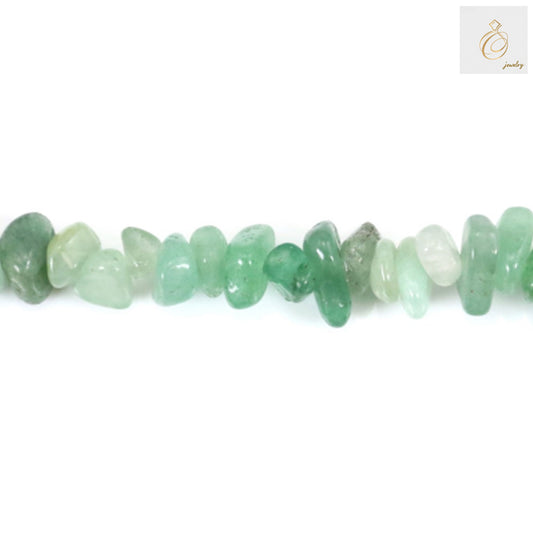 Close-up view of green aventurine chip beads showing natural texture and color variations"
"Green aventurine gemstone chips detail highlighting natural stone patterns and translucent quality