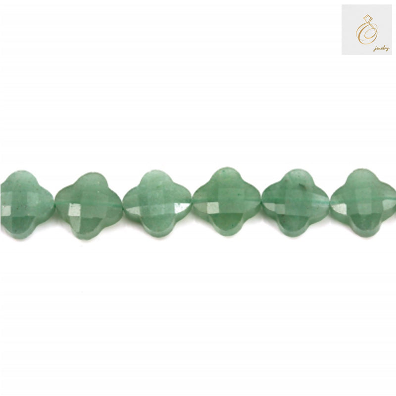 Close-up of green aventurine clover bead showing faceted surface and natural stone patterns