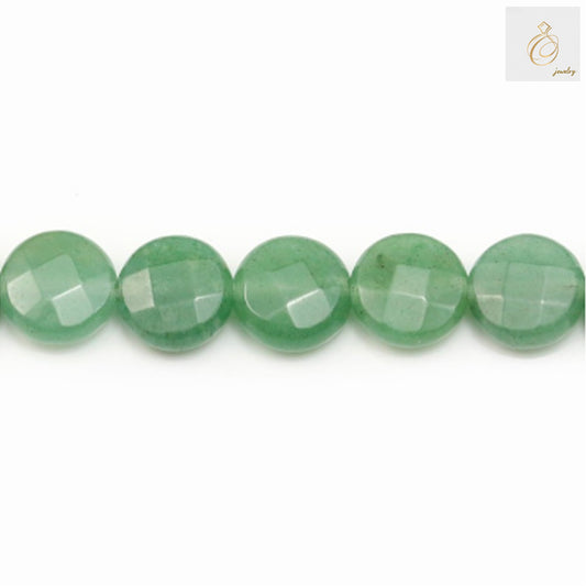 Close-up view of green aventurine bead showing faceted surface and natural color"
"Green aventurine beads size comparison with ruler showing 10mm diameter"
"Full strand of green aventurine beads displaying consistent quality and color