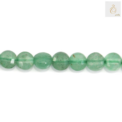 Close-up of green aventurine faceted beads showing sparkle and clarity"
"Green aventurine bead strand detail showing uniform 4mm size"
"Natural green aventurine gemstone beads texture and color detail