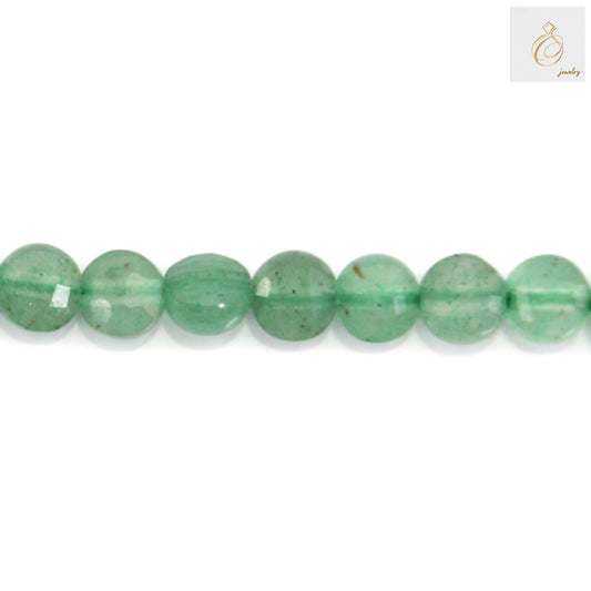 Close-up of green aventurine faceted beads showing sparkle and clarity"
"Green aventurine bead strand detail showing uniform 4mm size"
"Natural green aventurine gemstone beads texture and color detail
