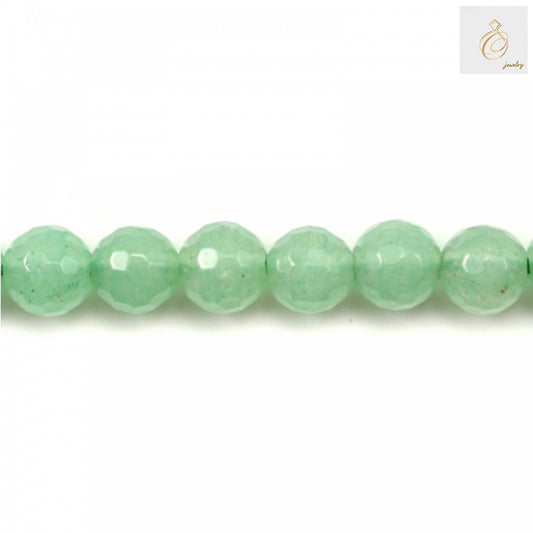Close-up view of green aventurine 8mm faceted round beads displaying natural stone texture and precision cut quality