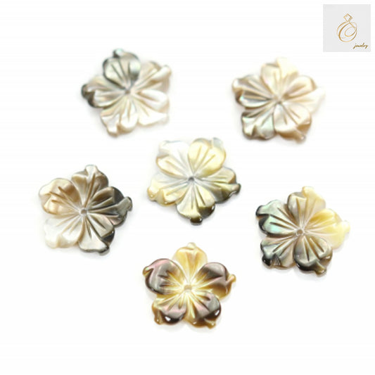 Grey mother-of-pearl flower charm, 12mm diameter, showing natural iridescent surface and delicate petal details