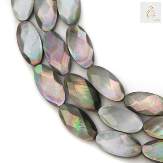 Close-up view of grey mother of pearl shell beads displaying faceted oval cut and natural grey coloring, jewelry making supplies