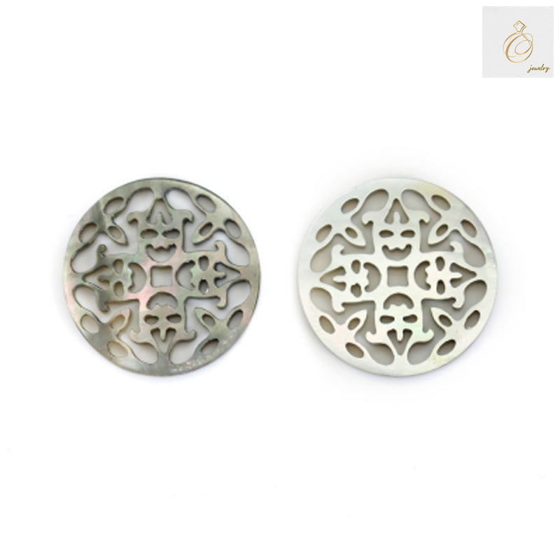 Close-up view of grey mother-of-pearl shell charm displaying intricate openwork details and lustrous finish for jewelry making