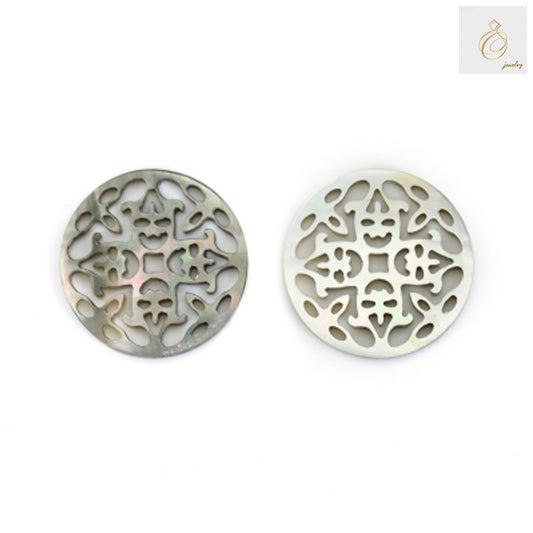 Close-up view of grey mother-of-pearl shell charm displaying intricate openwork details and lustrous finish for jewelry making