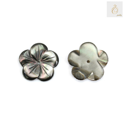 Close-up view of grey mother of pearl flower charm showing lustrous surface texture and natural variations