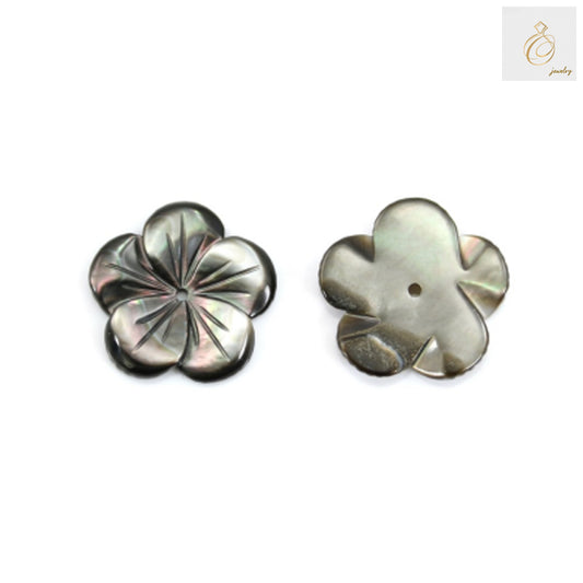 Close-up view of grey mother of pearl flower charm showing lustrous surface texture and natural variations