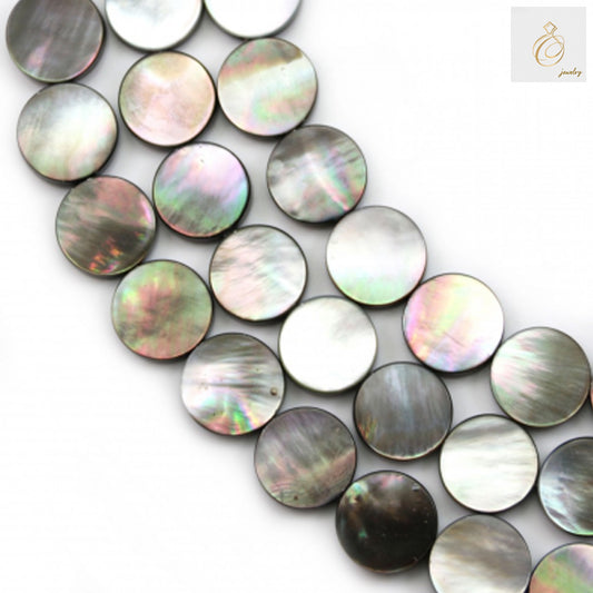 Close-up view of grey mother of pearl shell beads showing natural iridescent surface and 0.8mm holes