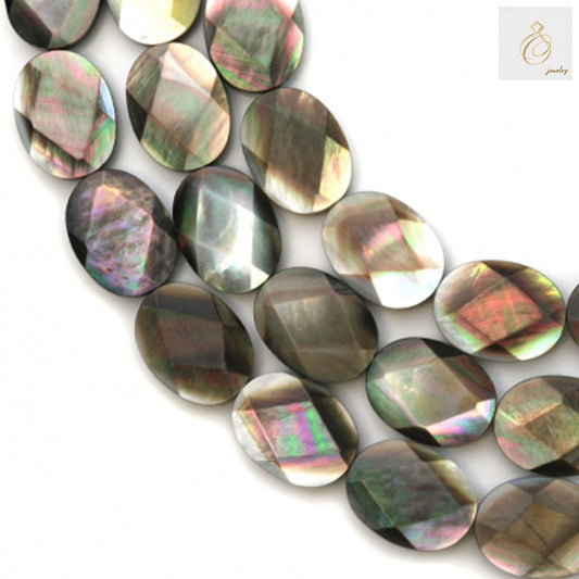 Close-up view of grey mother of pearl shell beads displaying faceted surface and oval shape for jewelry making