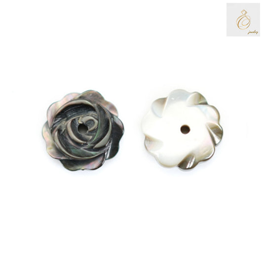 Close-up view of grey shell mother of pearl flower beads showing natural luster and flower shape details