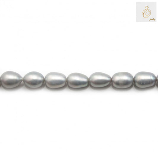 Premium grey oval freshwater pearls on white background
