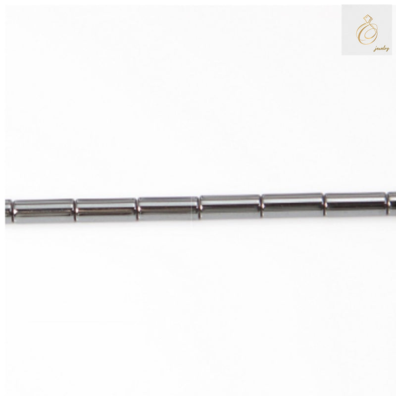 Natural hematite cylinder beads 3x9mm with metallic gray finish, arranged on strand showing uniform shape and lustrous surface