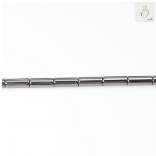 Natural hematite cylinder beads 3x9mm with metallic gray finish, arranged on strand showing uniform shape and lustrous surface