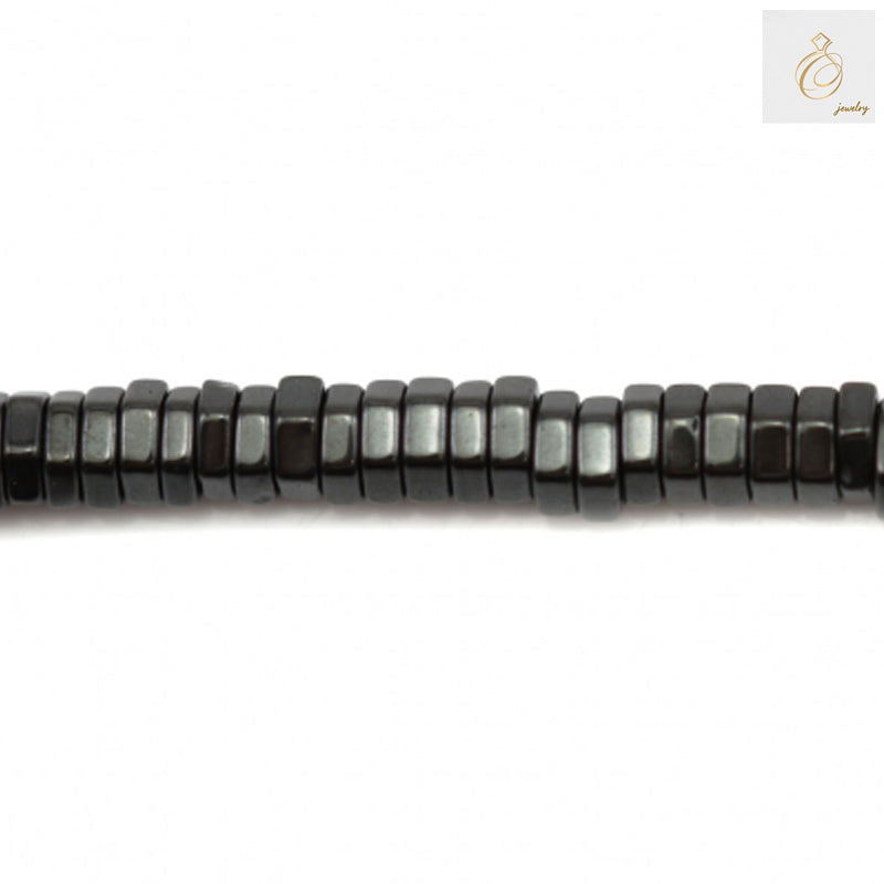 Hematite hexagon beads 3x1mm with 0.8mm holes on 39-40cm strand - close-up view showing metallic luster and uniform hexagonal shape