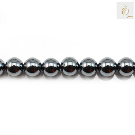 Natural hematite round beads 6mm diameter with metallic luster, arranged on strand for jewelry making