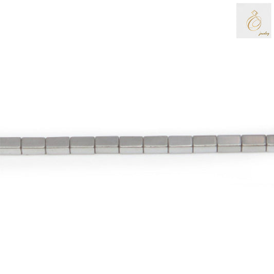 Hematite silver rectangle beads 2x4mm arranged on strand showing metallic finish and precise rectangular cut