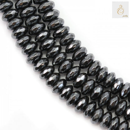 Close-up view of hematite faceted abacus beads showing detailed cut and uniform size 2x4mm