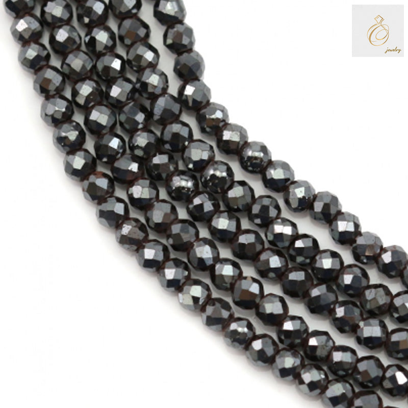 Close-up view of hematite faceted round beads 2mm showing detailed faceted surface and hole