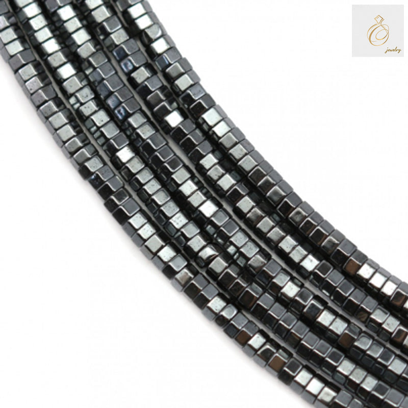 Close-up view of hematite hexagon bead strand showing 0.8mm holes and consistent 2x1mm sizing for jewelry making