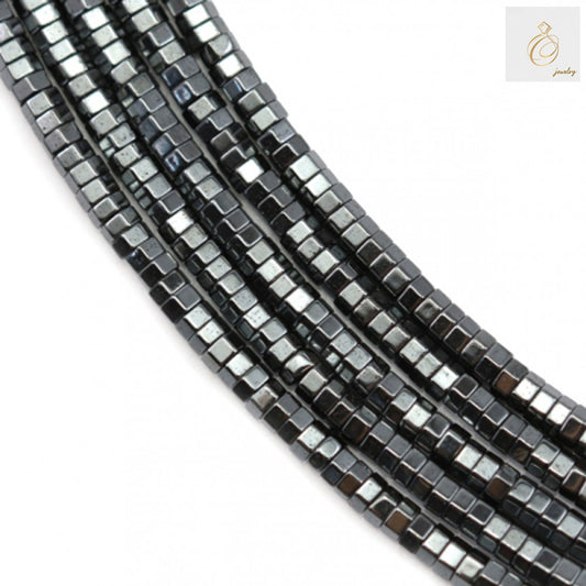 Close-up view of hematite hexagon bead strand showing 0.8mm holes and consistent 2x1mm sizing for jewelry making