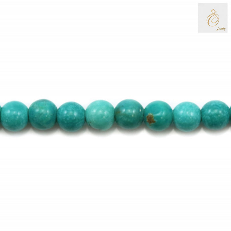 Close-up detail of 2mm howlite dyed round beads showing smooth surface texture and 0.4mm holes for jewelry crafting