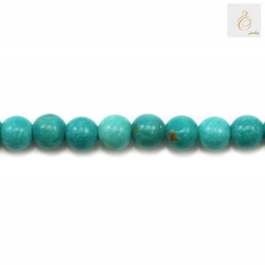Close-up detail of 2mm howlite dyed round beads showing smooth surface texture and 0.4mm holes for jewelry crafting