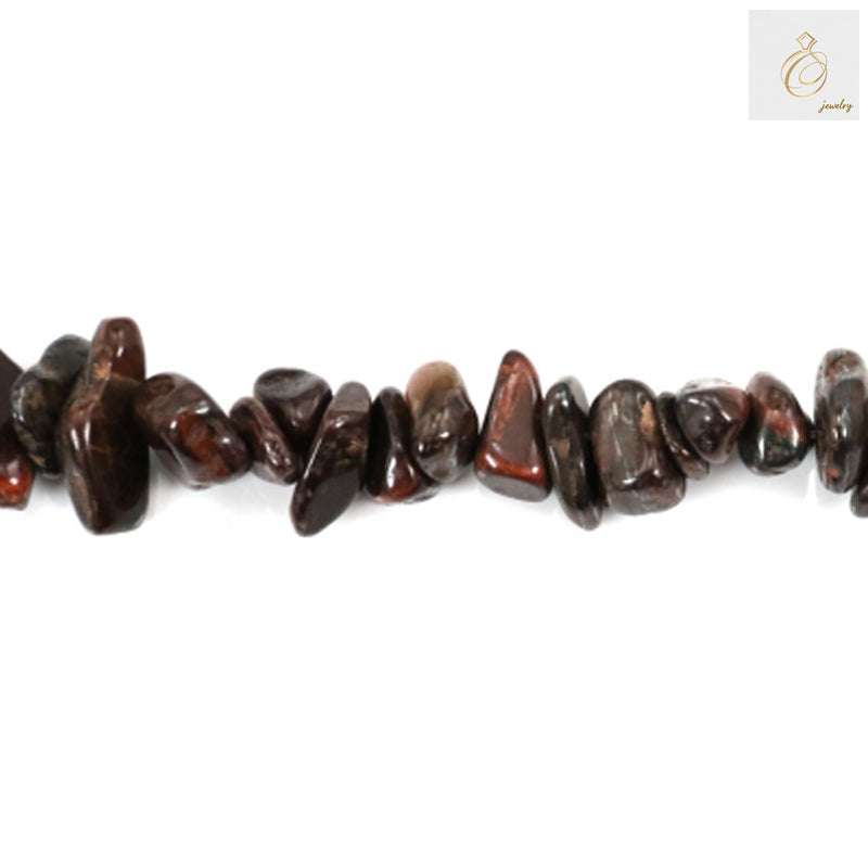 Close-up view of tiger's eye chip beads displaying natural golden-brown coloration and silky luster typical of authentic gemstone