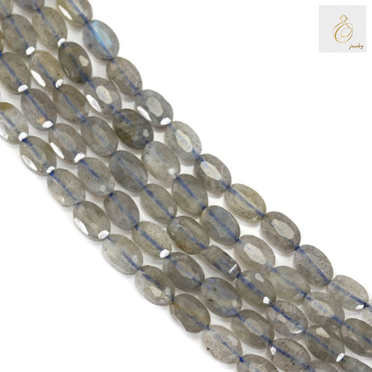 Natural labradorite faceted oval beads 4x6mm showing beautiful flash and color"
"Close-up view of labradorite gemstone beads with faceted oval cut
