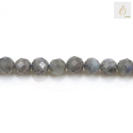 Natural labradorite faceted round beads 6mm diameter showing blue and green flash colors on white background