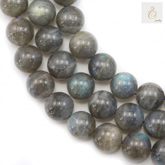 Natural labradorite round beads 12mm diameter showing iridescent blue and green flash"
"Close-up of labradorite gemstone beads strand with smooth polished finish